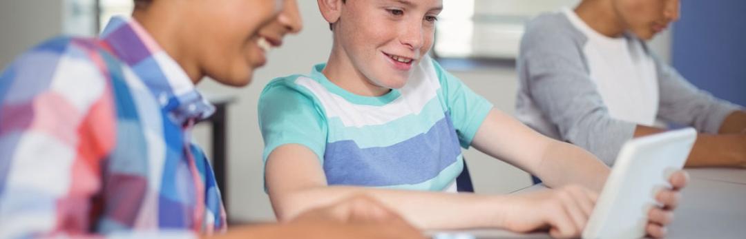 young boys using tablet