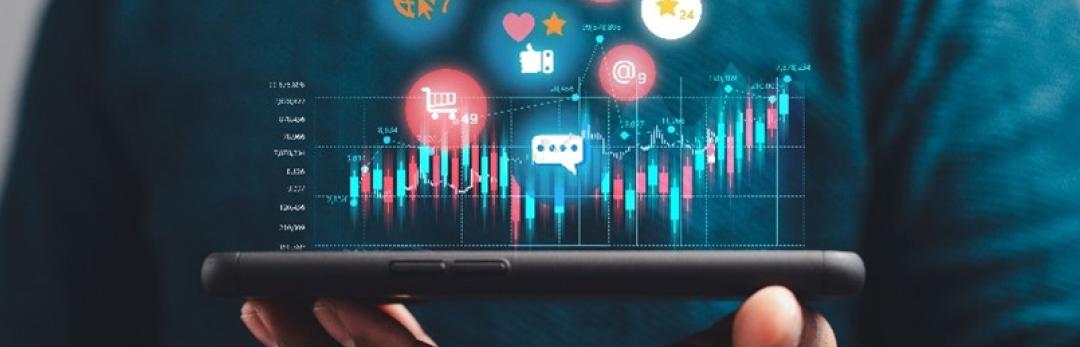 Handing holding phone horizontally with graphics of different apps floating above.