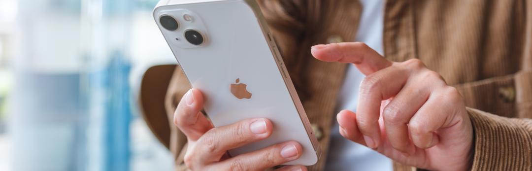 woman using latest iphone with ios 18