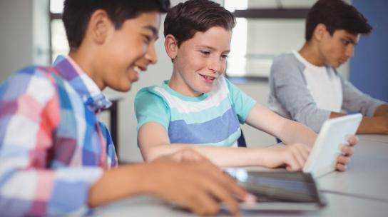 young boys using tablet