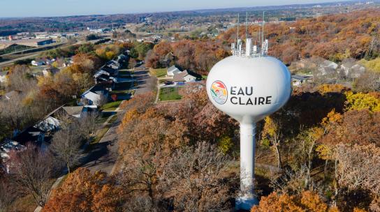 Eau Claire Water Tower with a fall backdrop