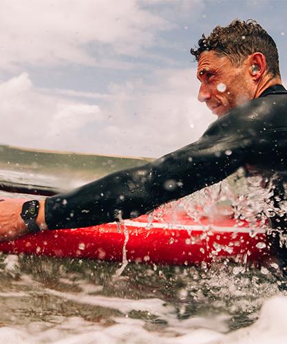 Surfer wearing Apple Watch Series 10 42mm.